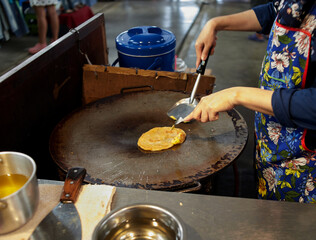 Roti on flying pan in the street food © Anucha