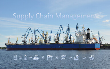 Blue and red ship loaded by port cranes with bulk material in a sea harbor with supply chain text...