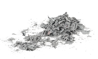 Pile of charred paper money isolated on a white background. Burned paper scraps.