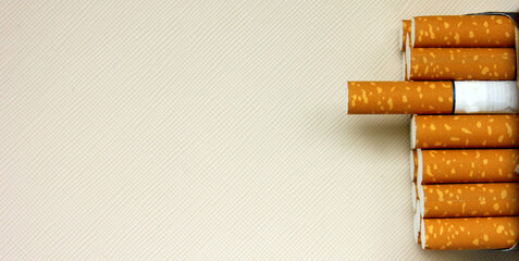 A pack of cigarettes on a white background. open pack of cigarettes. Yellow filter. Harm to health. It is a bad habit. The concept of World No Tobacco, Tobacco and Lung Health. Cigarettes in a tutu.