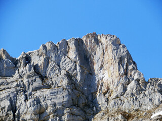 Rocky peak Mutteristock (2295 m) in the in the Schwyz Prealps mountain range, and over the Wägitalersee reservoir lake (Waegitalersee or Wagitaler lake) - Canton of Glarus, Switzerland (Schweiz)