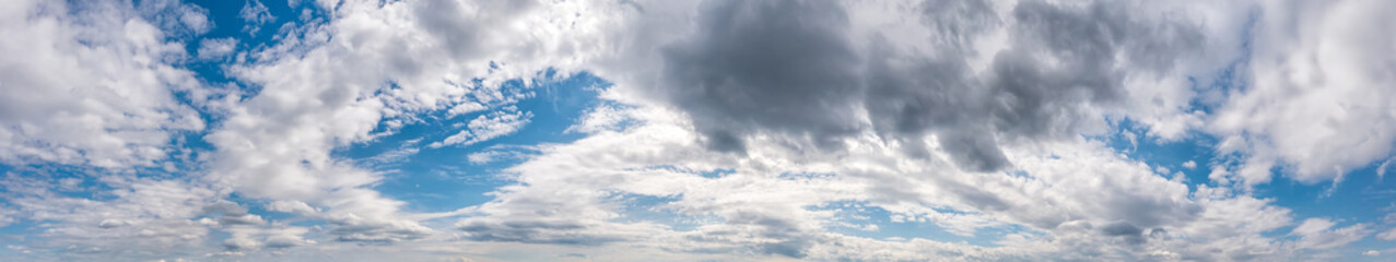 Panoramic view of blue sky with stunning stormy clouds