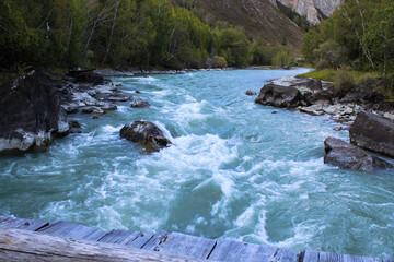 River threshold on the mountain river Chuya in the Republic of Altai, Siberia, Russia. Autumn...