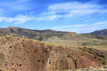 Mountains Mars 1 on a background of blue sky and clouds in Siberia, Russia