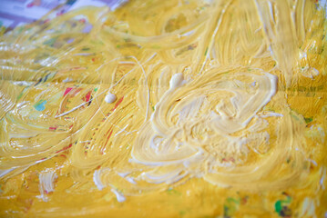 Drawing with paints. Abstract drawing in yellow. Drawing of a child with Autism. Autism special school