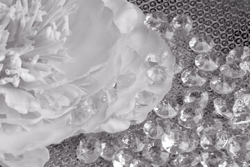 black and white close up of  diamonds on p textured with accessories