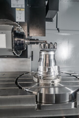 Metalworking CNC milling machine. Cutting metal modern processing technology.