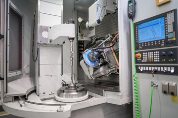 Metalworking CNC milling machine. Cutting metal modern processing technology.