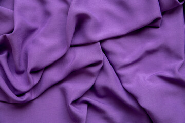 Purple fabric background. The texture of the fabric.