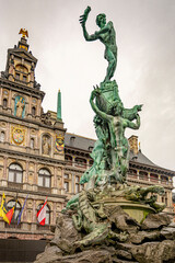 The statue at the old central square market in Antwerp in a rainy day