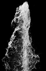 Water splash isolated over black background, vertical orientation