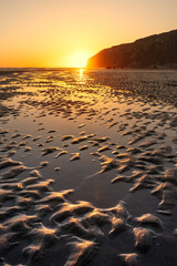 Sunrise on a beach in Speeton, East Yorkshire, UK
