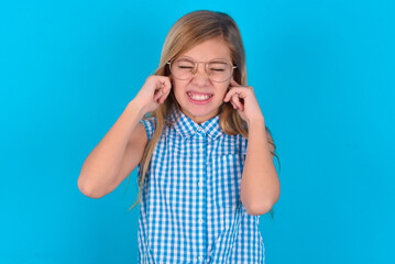 Stop making this annoying sound! Unhappy stressed out little kid girl with glasses wearing plaid...