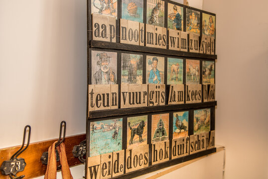 Hoorn, Netherlands, March 2022. Old-fashioned reading board of the Dutch language from the 1950s.