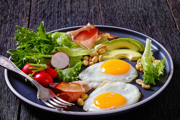 fried eggs, lettuce, avocado, radish, peanuts, ham
