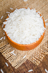 Rice in a bowl on wooden table