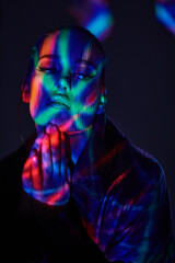 woman lit by lazer beams