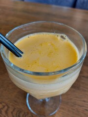 A glass glass with freshly squeezed orange juice. Healthy and delicious drink