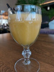 A glass glass with freshly squeezed orange juice. Healthy and delicious drink