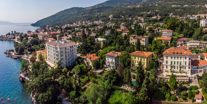 Beautiful panoramic view of Lovran village and its sea shore in Croatia. Top view photo taken on drone.