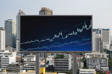 Forex and stock market chart hologram on road billboard over panorama city view of Bangkok. The financial center in Southeast Asia. The concept of international trading.