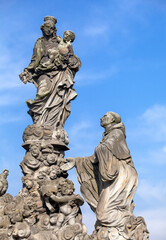 Fototapeta na wymiar Statues of Madonna and St. Bernard on the Charles bridge in Prague