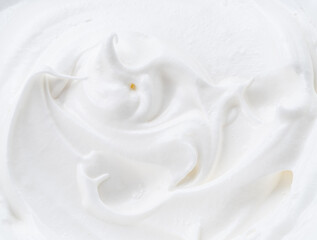 Creamy pics in yoghurt or cream surface. Top view.