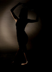 Obraz na płótnie Canvas Standing silhouette in studio