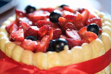 Closeup of delicious biscuit fresh strawberry cake