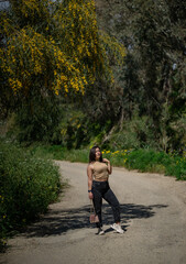 girl standing under the tree admires green Malta view 