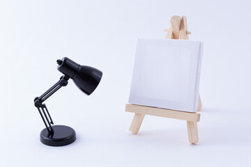 Wooden Easel Miniature with Blank White Square Canvas for Artists and Painters - Mockup. Mini...