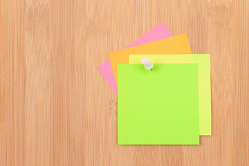 Colored Sticky Notes with Copyspace Pinned to the Wooden Message Board. To Do List Reminder in Office. Blank Memo Sticker at Work - Template. Empty Checklist - Mockup