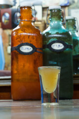 ginger shot served with olives and vegetable salad 