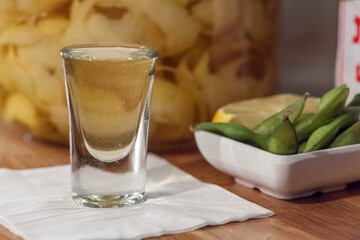 shot served with edamame beans 