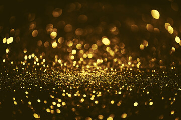 Fototapeta na wymiar Golden glitter bokeh lighting texture Blurred abstract background for birthday, anniversary, wedding, new year eve or Christmas