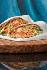 Beef wrap filled with vegetables and sauces 