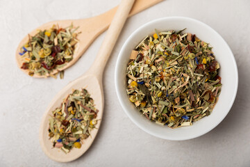 Herbal tea in a white ceramic bowl and spices on a light background. tea for immunity and detox.  space for text. Tea ceremony