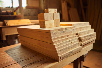 Wooden boards are stacked in a sawmill or carpentry shop. Sawing drying and marketing of wood....