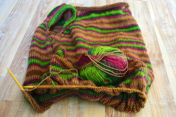 multicolored, warm knitted fabric sweater, knitting texture, fuzzy background