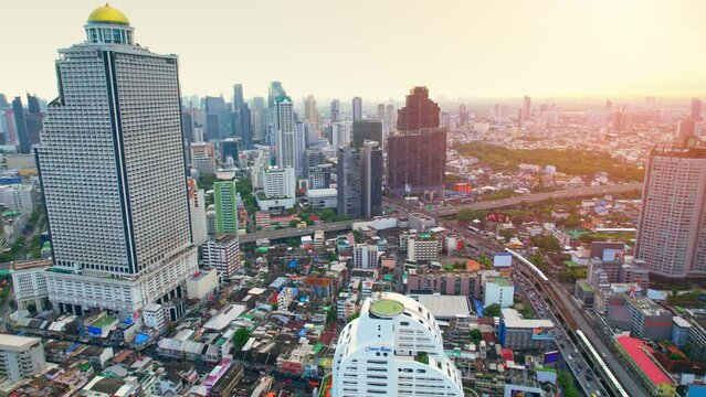 4K UHD : Bangkok thailand aerial city view drone footage over the city. skyscraper and high rise buildings at sunset. 4k aerial city
