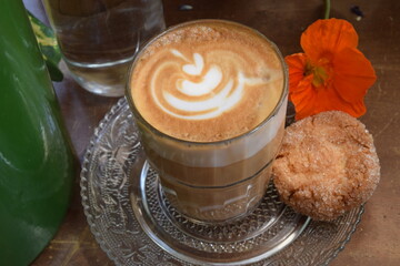 Cappuccino served with a cookie 