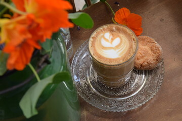 Cappuccino served with a cookie 