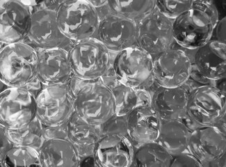 many transparent balls in black and white