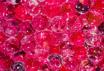 a close up with many red transparent balls