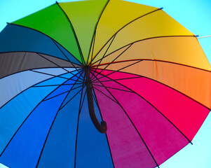 Opened umbrella in rainbow colors - symbol for protection and diversity
