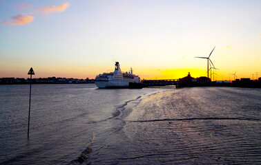 Small classic white cruiseship or cruise ship liner Astor on River Thames at Tilbury port near...