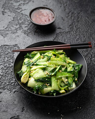 Chinese fried Pak Choi with garlic, sesame seeds. Healthy food