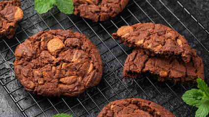 Chocolate, orange chip cookies on cooling rack