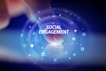 Finger touching tablet with social media icons concept