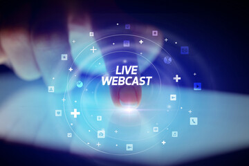 Finger touching tablet with social media icons concept